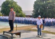 Polisi Peduli Pendidikan, Kapolsek Belo Jadi Irup Bendera di SMA Negeri I Belo
